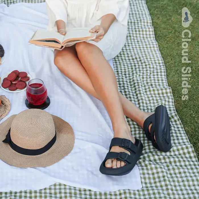 Black Bloom sandals worn at a picnic